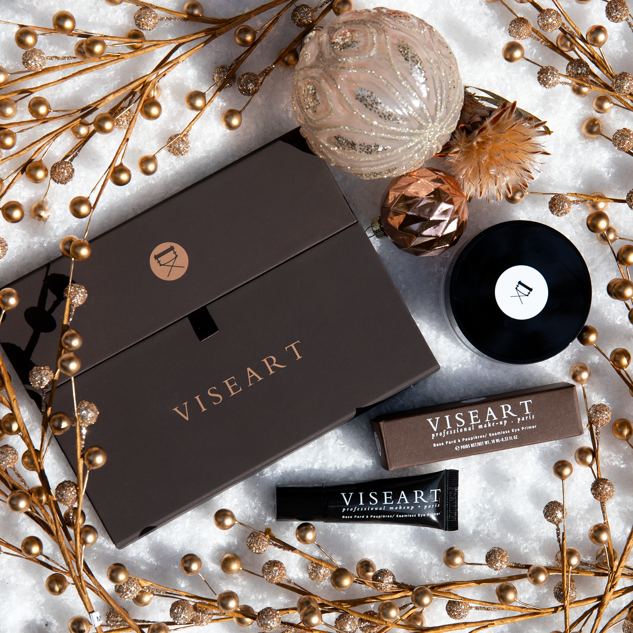 Viseart Eye Primer placed beside a curated edit of palettes, showcasing its essential role in longwear eye artistry.