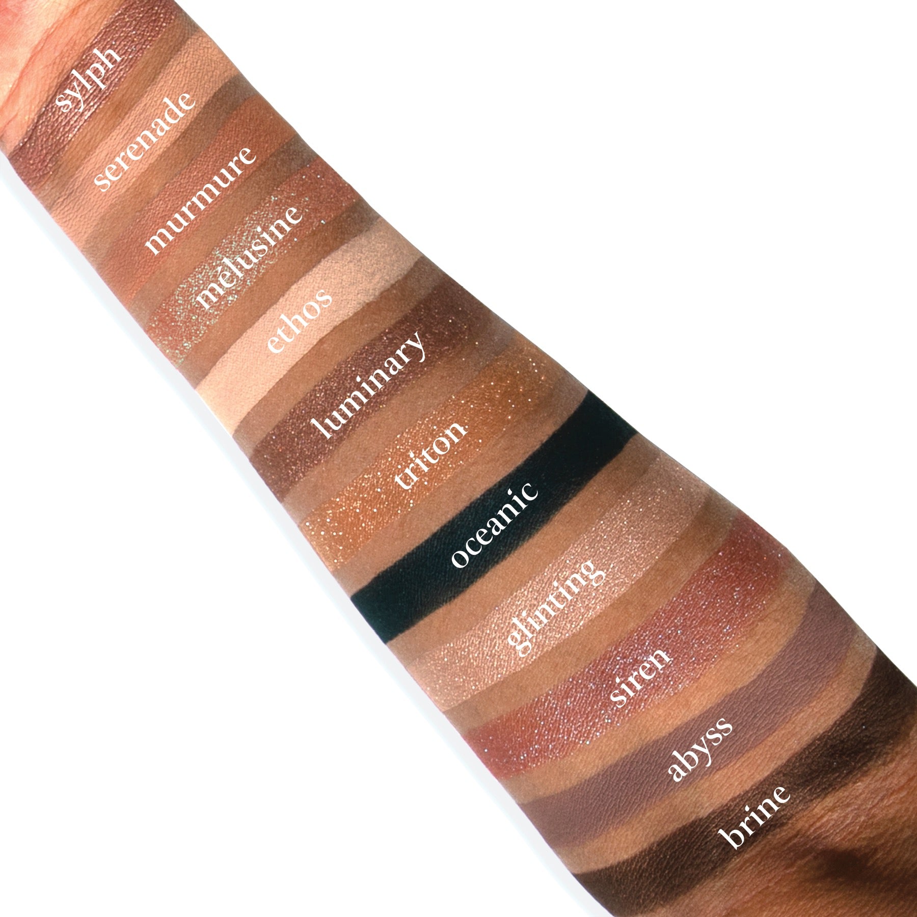 Swatches of Sireneuse Étendu on deep skin, showing luminous rose, plum shimmer, navy flip, and soft matte neutrals.