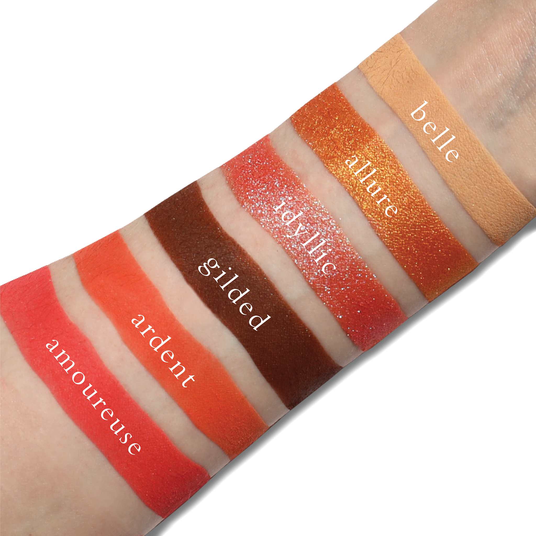 Swatches of Fleurette Bisous on fair skin showing petal pink, peach, and coral tones with radiant shimmer and soft matte finishes.