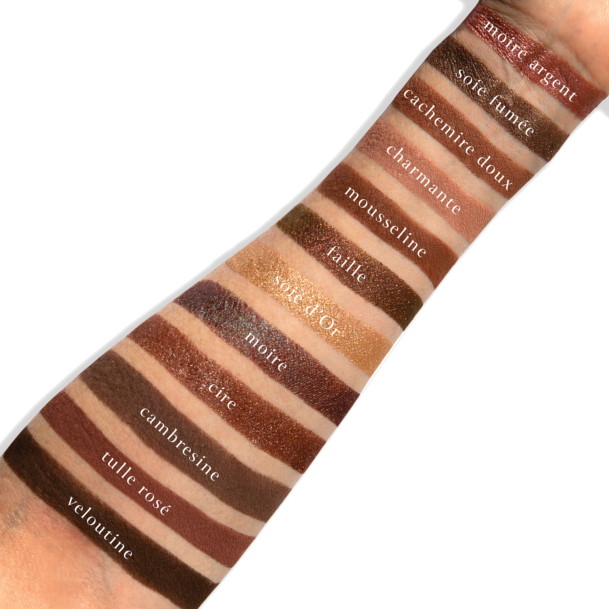 Swatches of Cashmerie Charmeuse on fair skin with antique gold, thistle shimmer, and plum matte shades.