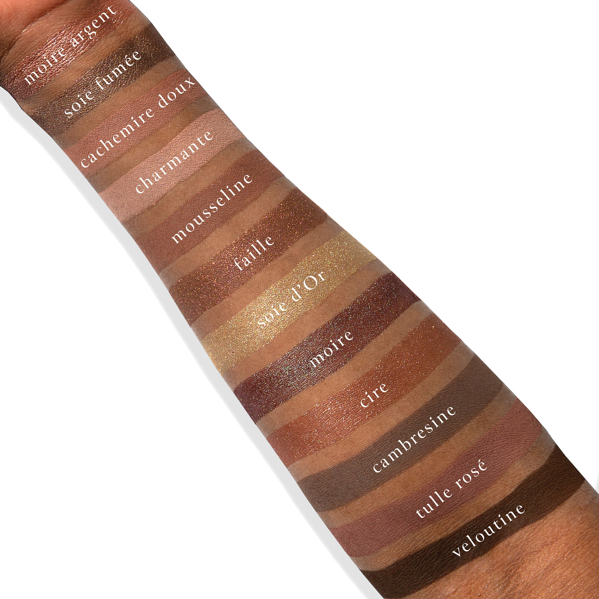 Swatches of Cashmerie Charmeuse on deep skin showing espresso, satin taupe, red-peacock duochrome, and soft rose.