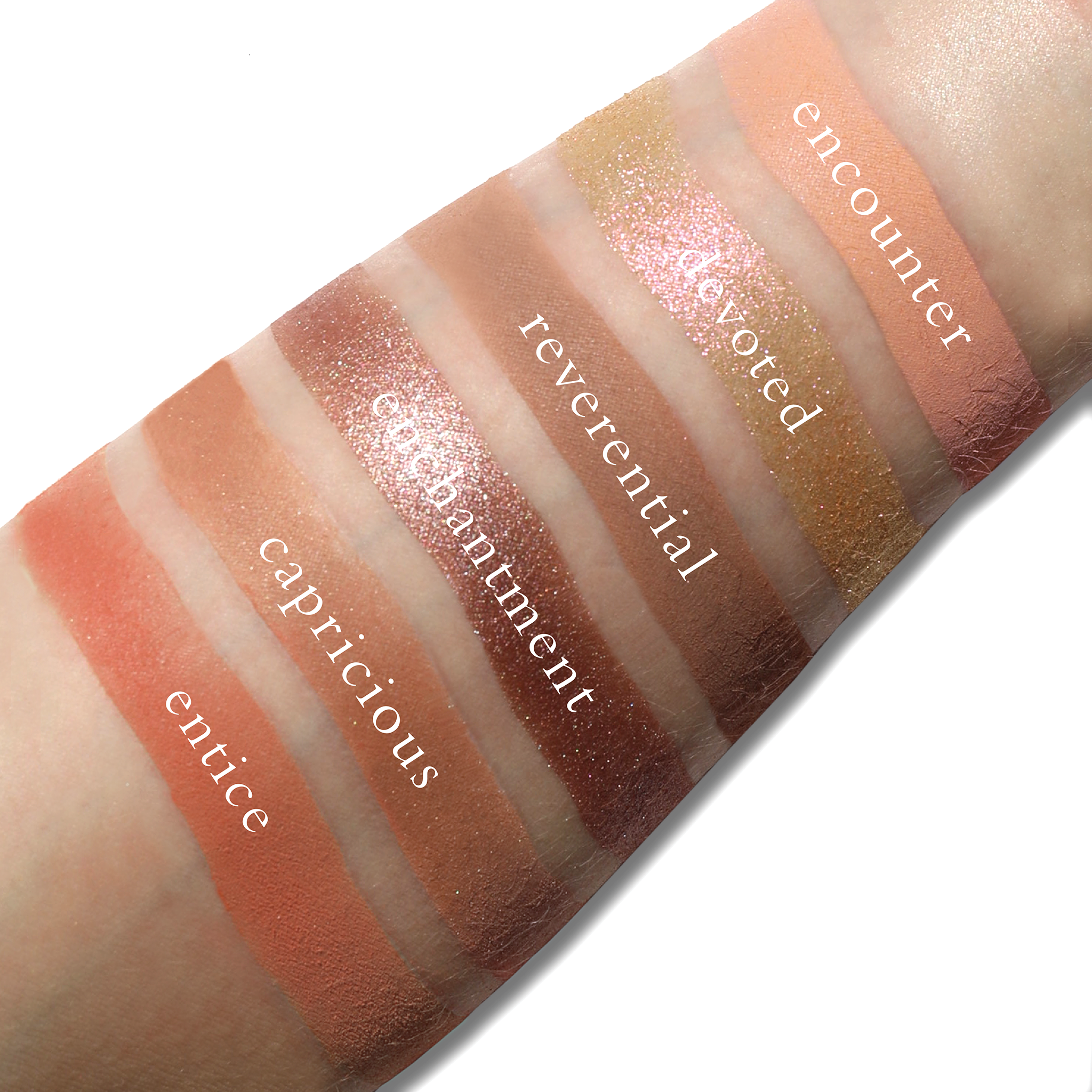 Swatches of Fleurette Coeur on fair skin with soft lilac, icy nude, and angelic pink tones in translucent and luminous finishes