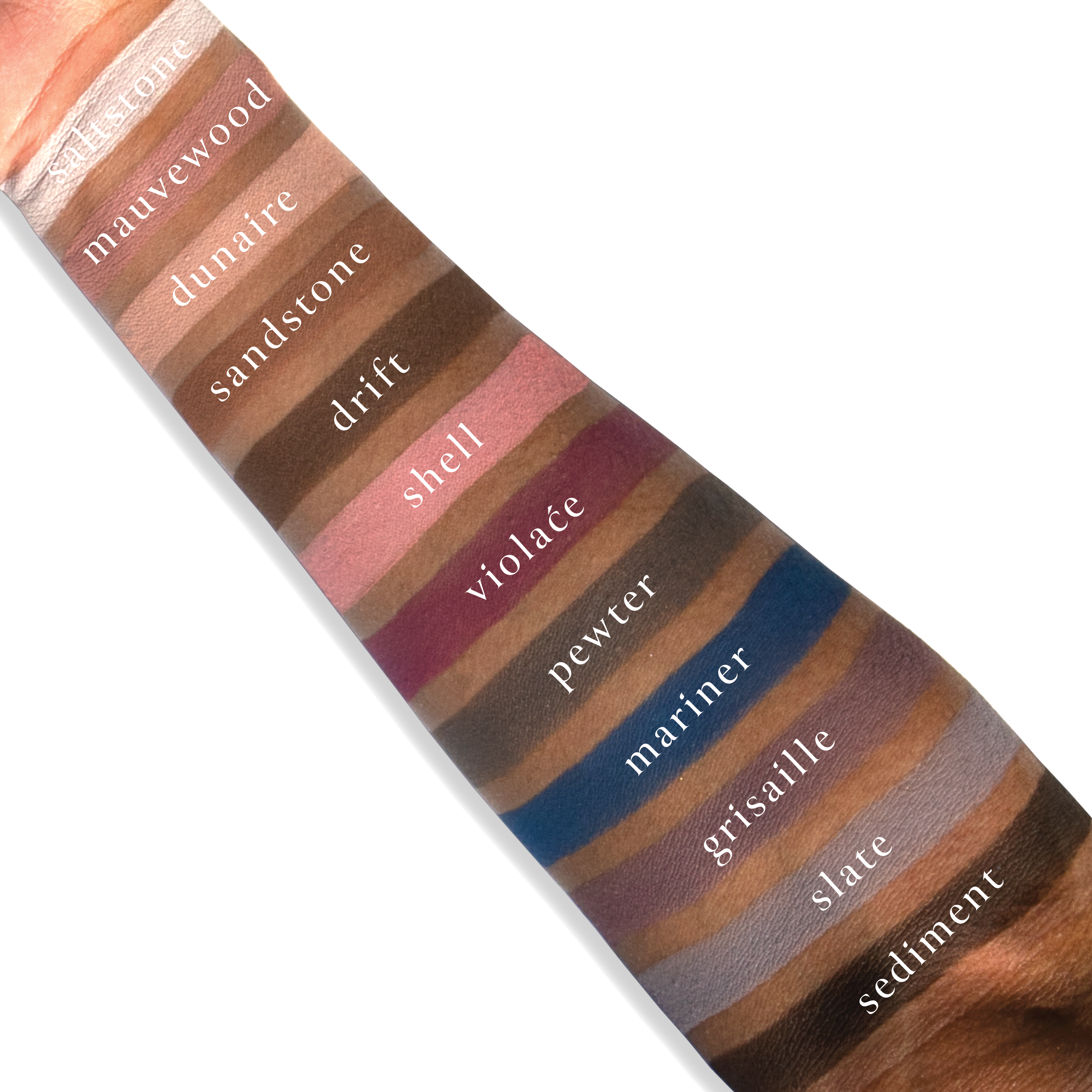 Swatches of mauve, lilac, taupe, and charcoal gray matte shades from Petites Mattes Cool Original on deep skin tone.