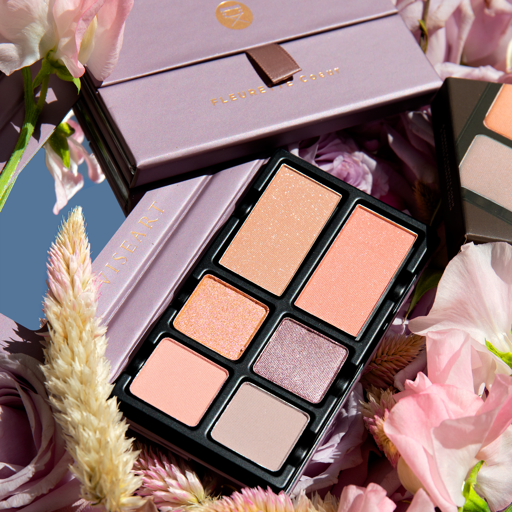 Fleurette Coeur open palette with sheer lilac, soft pink, icy nude, and pale mauve tones in soft matte and pearlescent finishes.