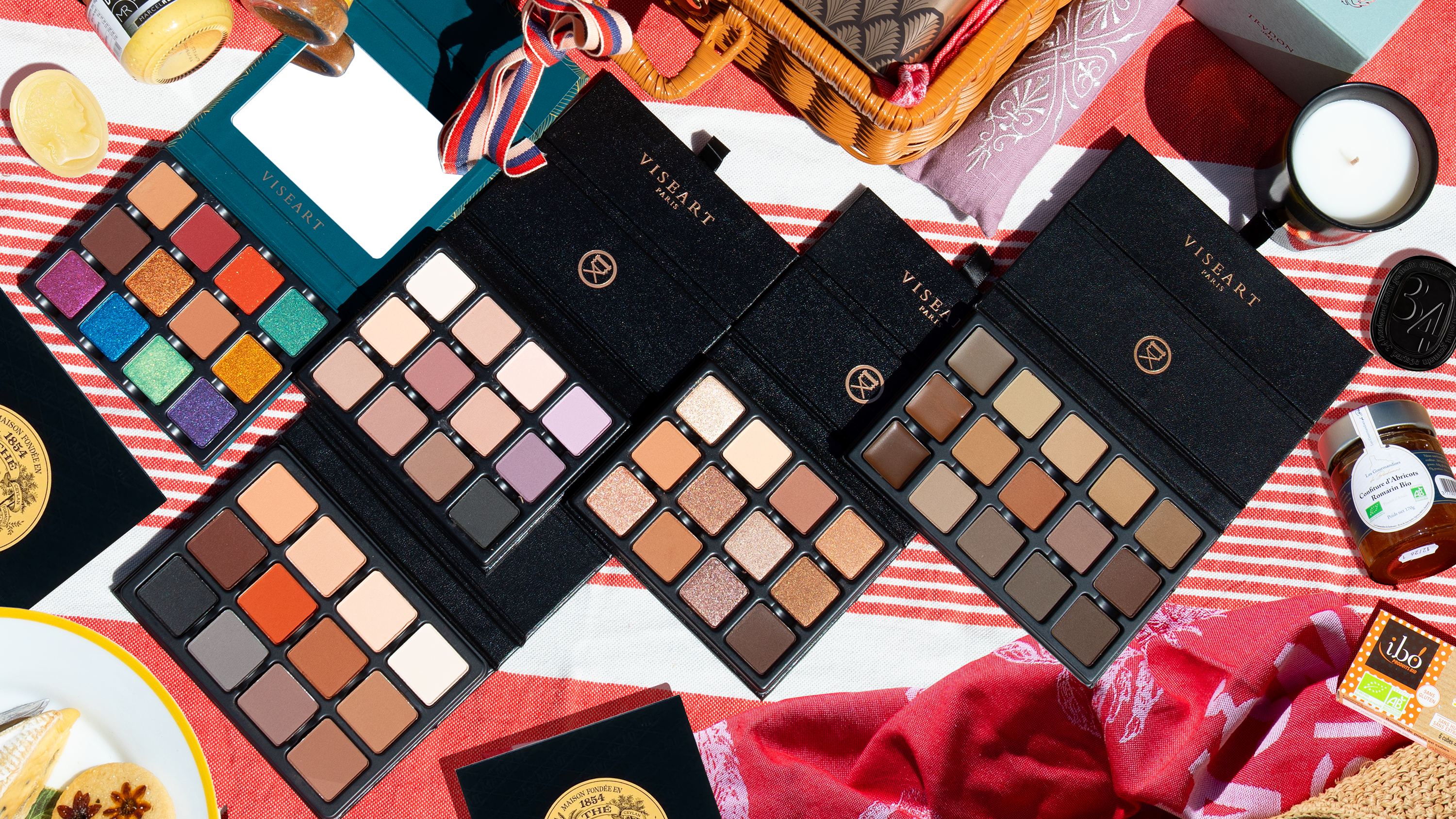 Viseart palettes and Parisian items in a wicker hamper, part of a $500+ giveaway