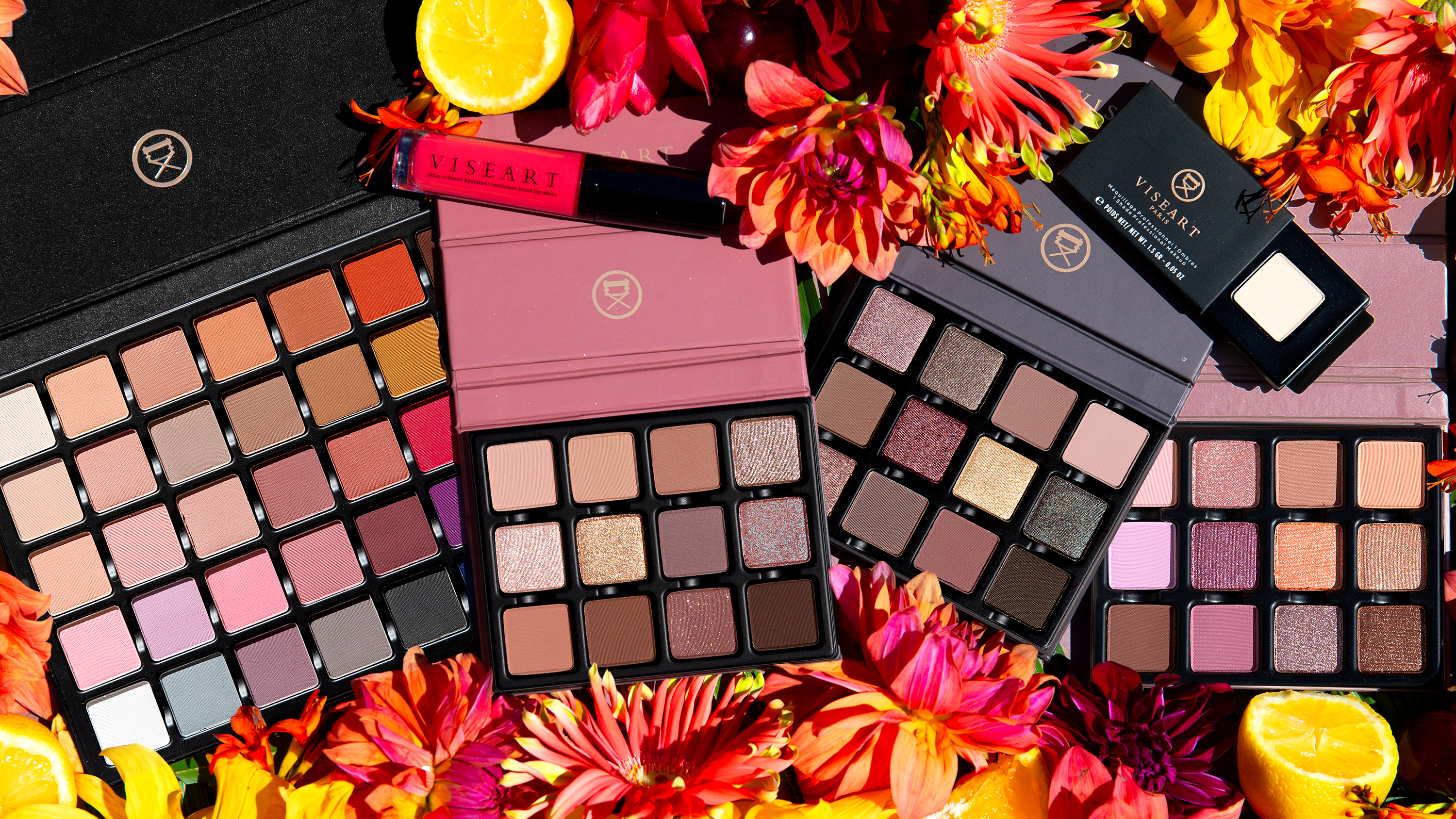 Flatlay of late summer-toned luxury eyeshadow palettes featuring matte, shimmer, multichrome, and duochromatic tones in a blendable pro-favourite formula.