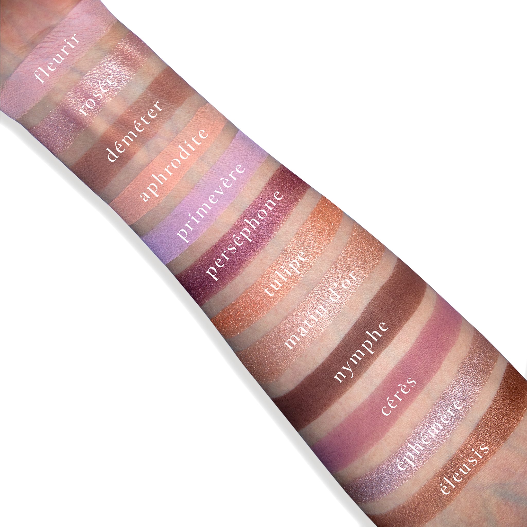Swatches of Paris Rêveries on fair skin with soft pink, champagne shimmer, lilac, and muted neutrals.