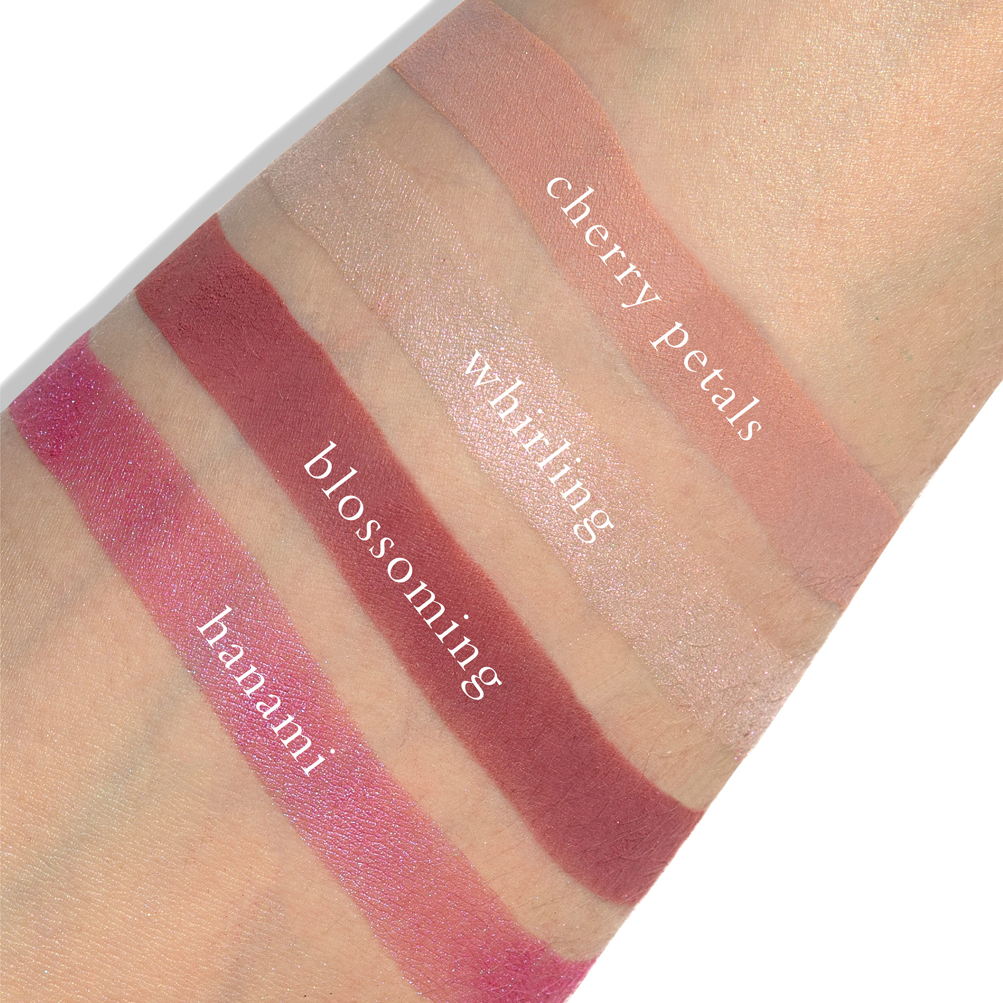 Swatches of sakura pink, light rose, and soft shimmer from Sakura Lotus on fair skin tone.