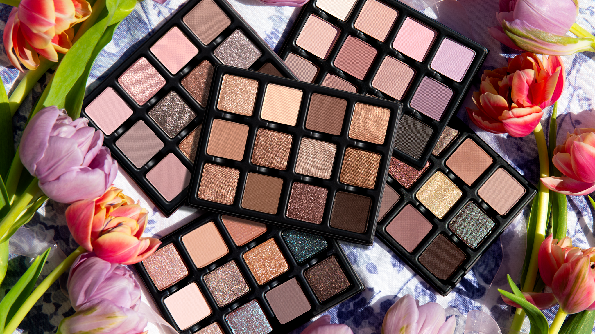 Flatlay of Viseart luxury eyeshadow palettes featuring matte, shimmer, and duochromatic tones in a blendable pro formula.