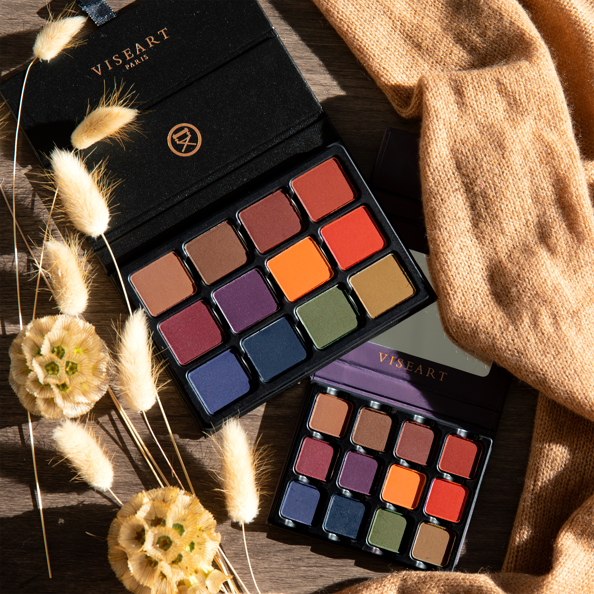 Open palette with deep matte shades like navy, oxblood, and bark, ideal for smoky definition and deep sculpting.