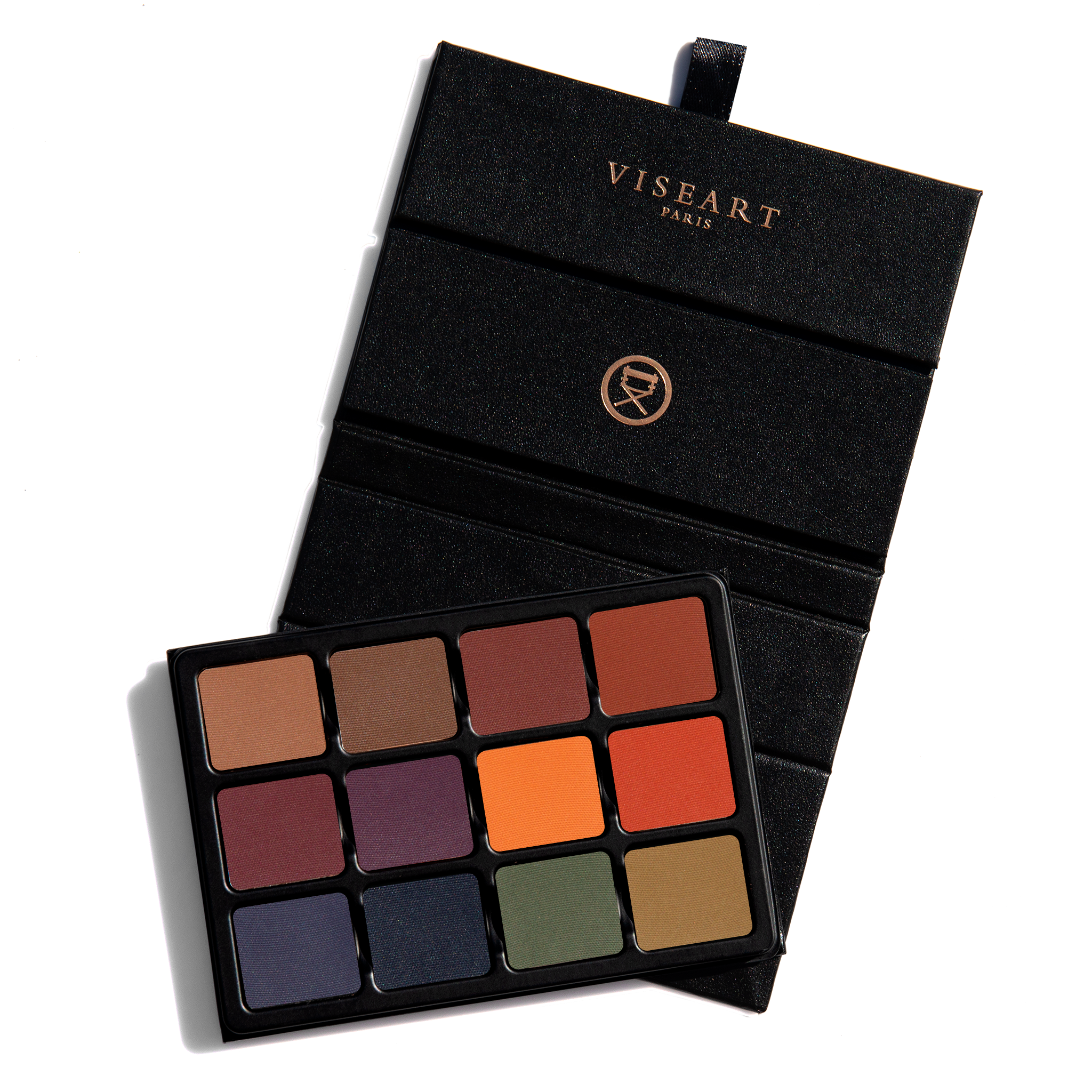 Open palette with deep matte shades like navy, oxblood, and bark, ideal for smoky definition and deep sculpting.