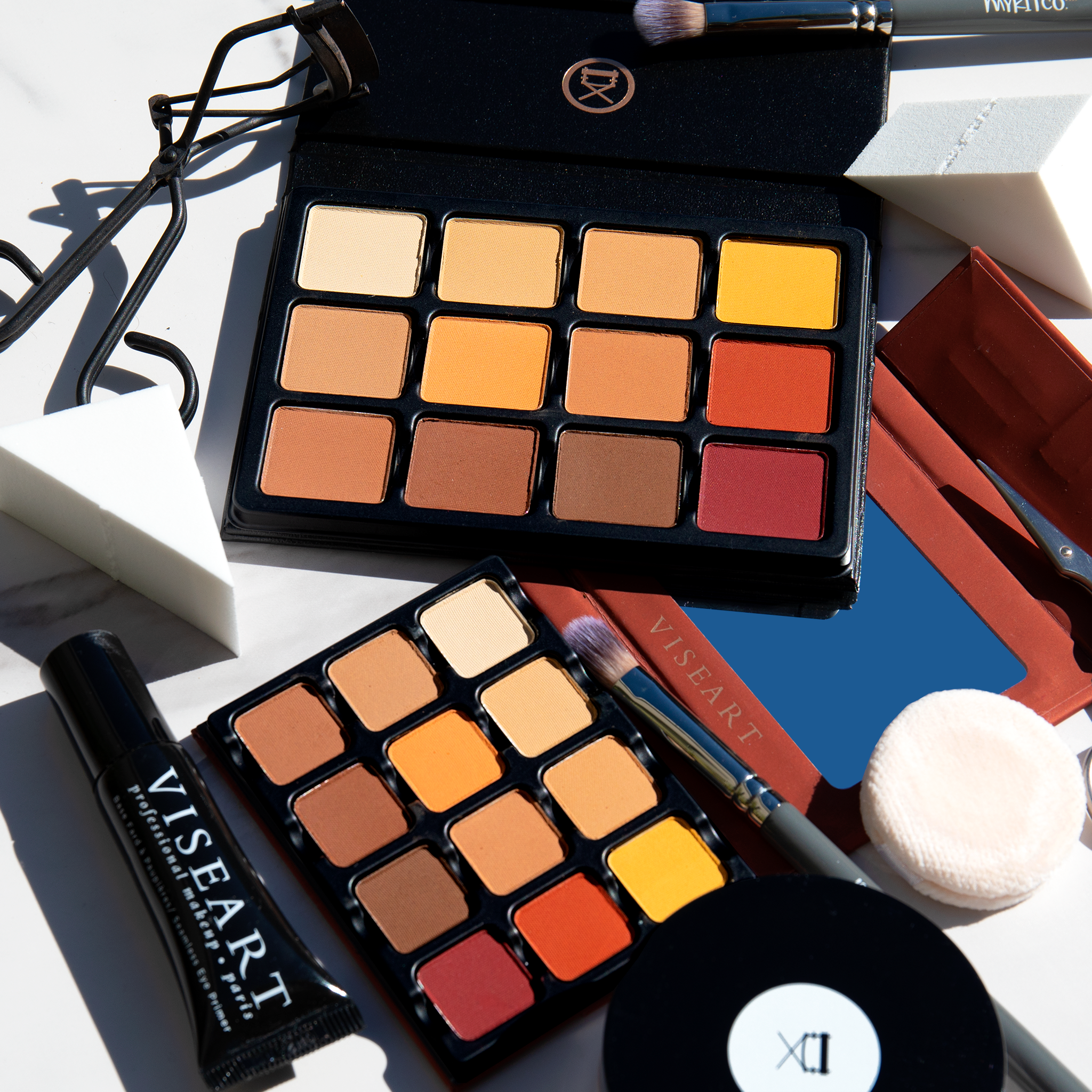 Open palettes showing warm matte tones from peach to deep terracotta, perfect for pro sculpting and warm neutral artistry.