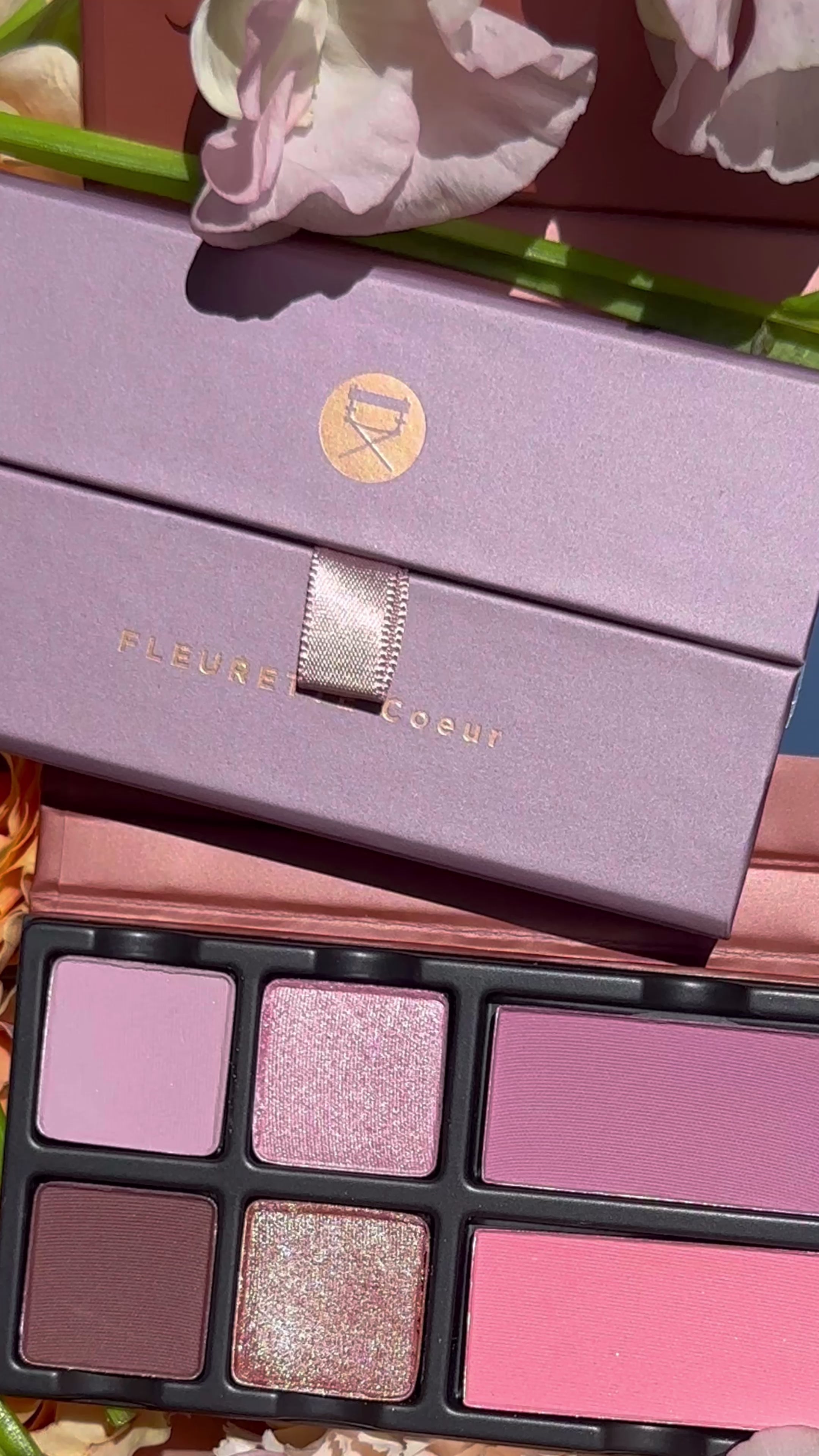 Video of Fleurette Bisous palette with rose pink, petal peach, and coral tones in matte and satin shimmer finishes for cheeks and eyes.