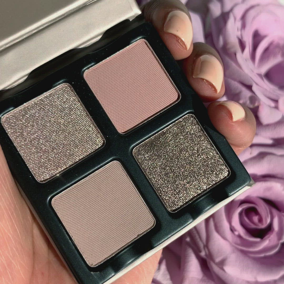 Up close video of a open Petits Fours Lilas palette with soft lilac, mauve, and pink-toned eyeshadows in shimmer and matte finishes.