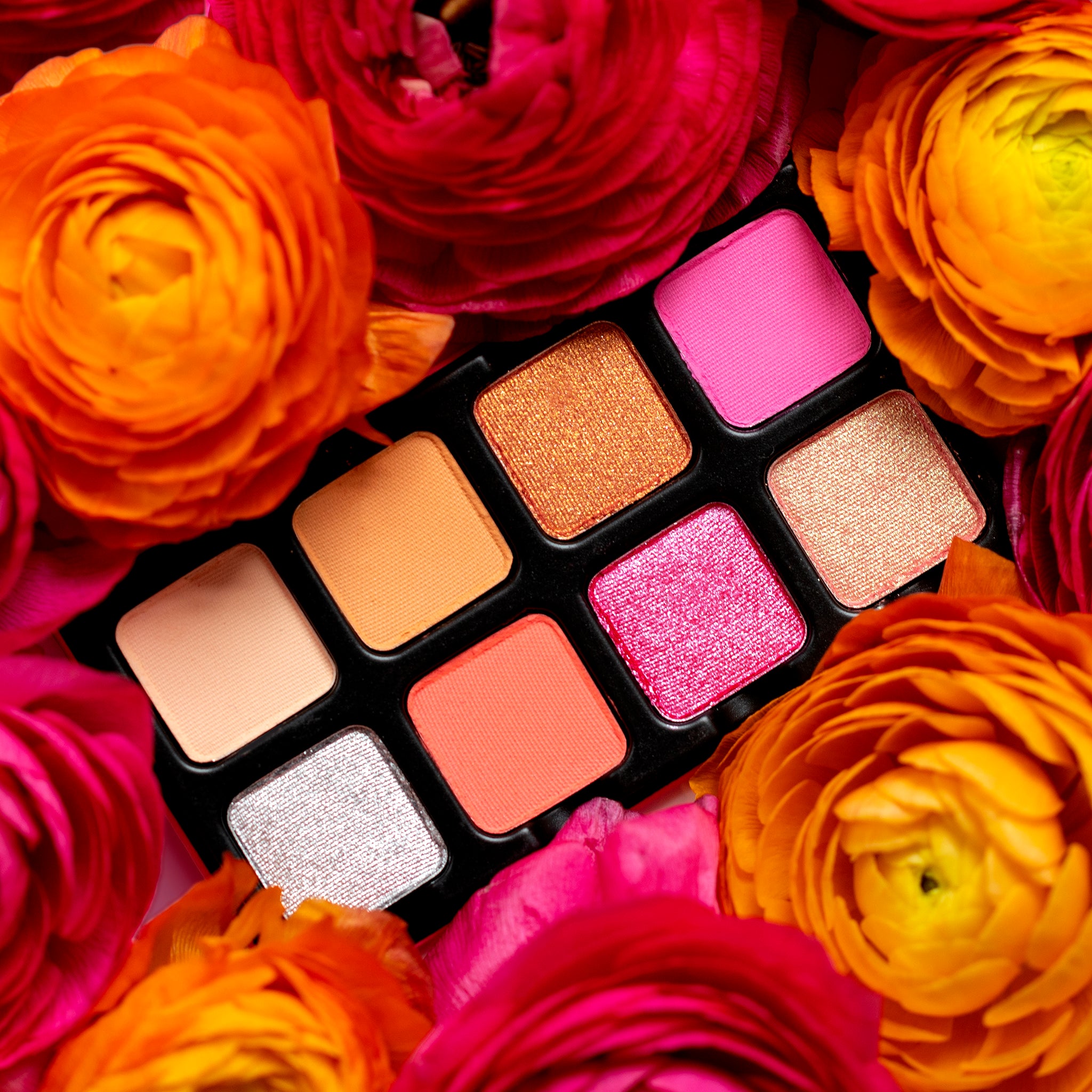 Open Petit Pro Chou Chou palette showing pastel pink, peach, lilac, and lemon shimmer eyeshadows.