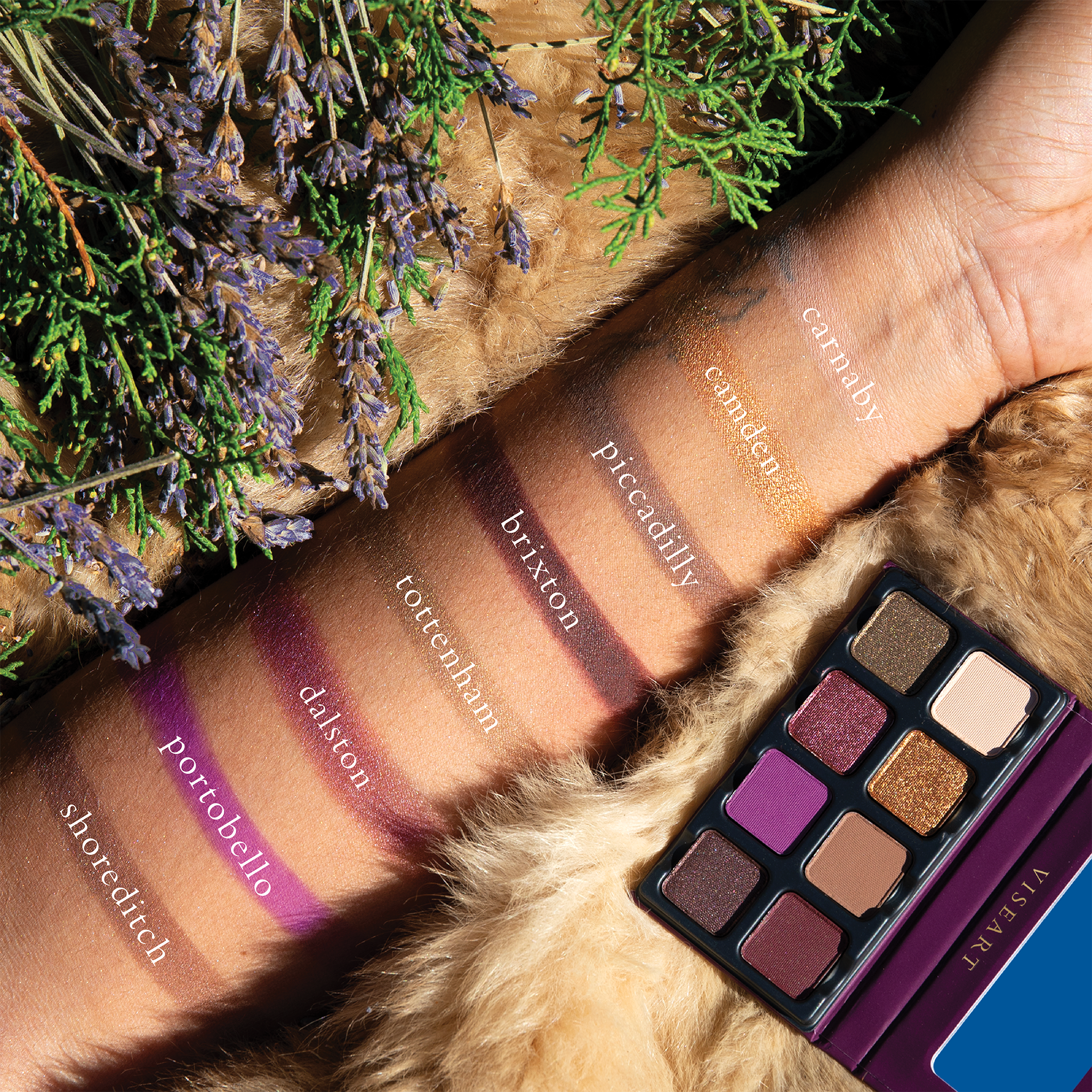 Swatches of plum, aubergine, and cool mauve tones on deep skin, showcasing depth, vibrancy, and wearable cool tones.