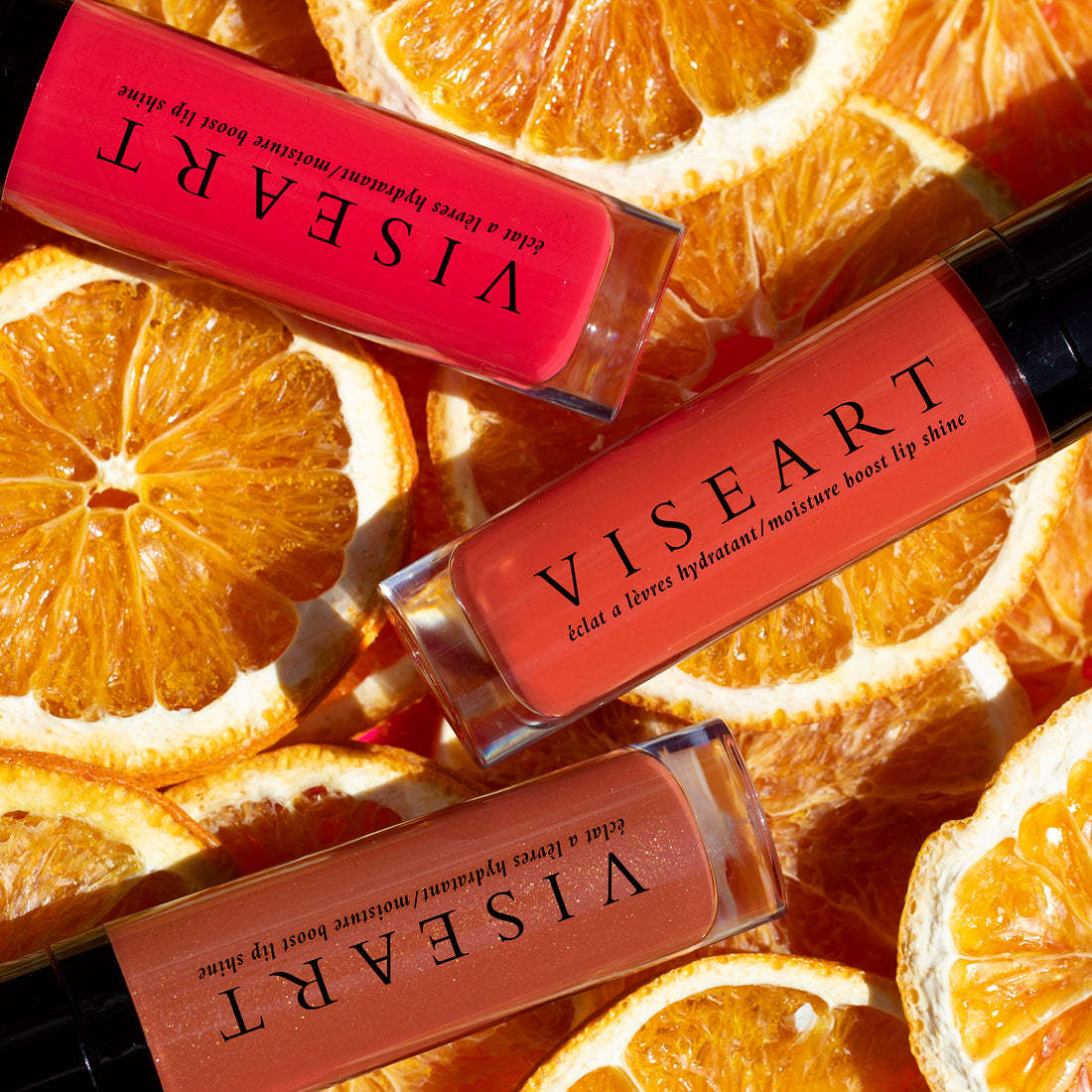 Viseart Moisture Boost Oil Lip Shine in ‘Scala’ – a clear tube with black cap, displaying a deep berry-tinted lip oil.