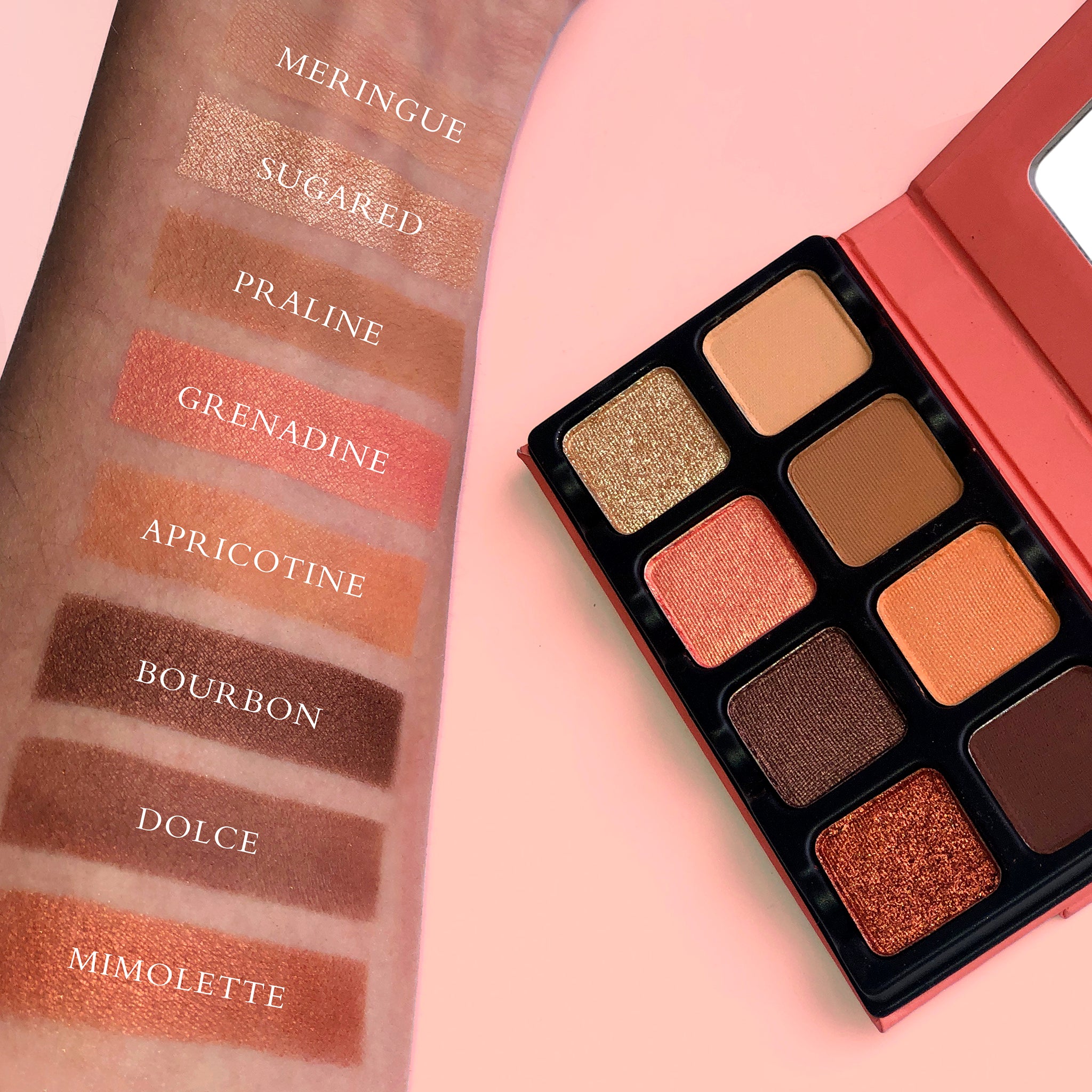 Swatches of warm coral, peach shimmer, and apricot tones on fair skin, showcasing blendability and pigment payoff