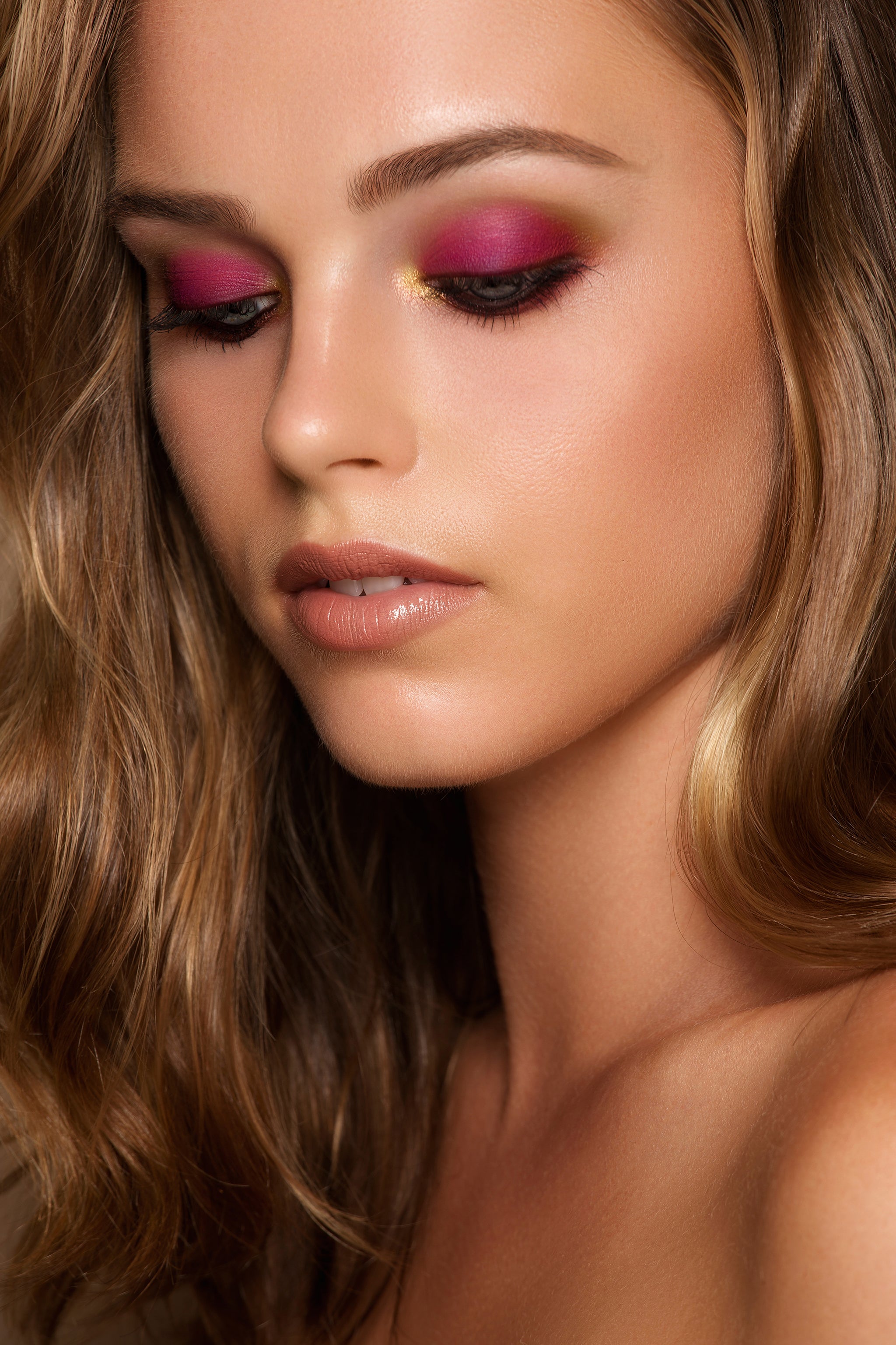 Petit Pro Soleil on model featuring bright citrus, coral, lavender, and golden shimmer tones.
