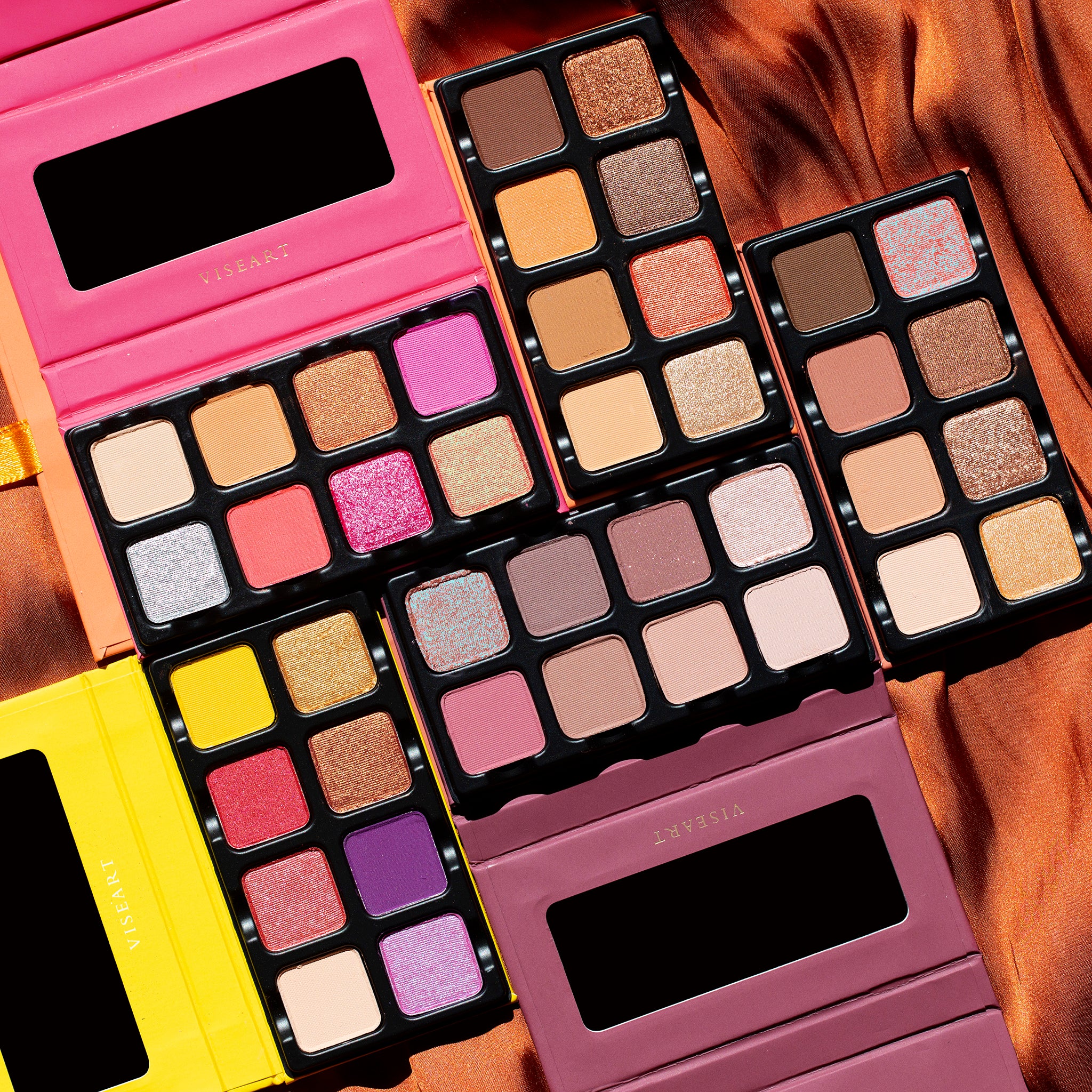 Petit Pro Apricotine shown with other Petit Pro palettes in a group shot, highlighting its warm tones and portable design.