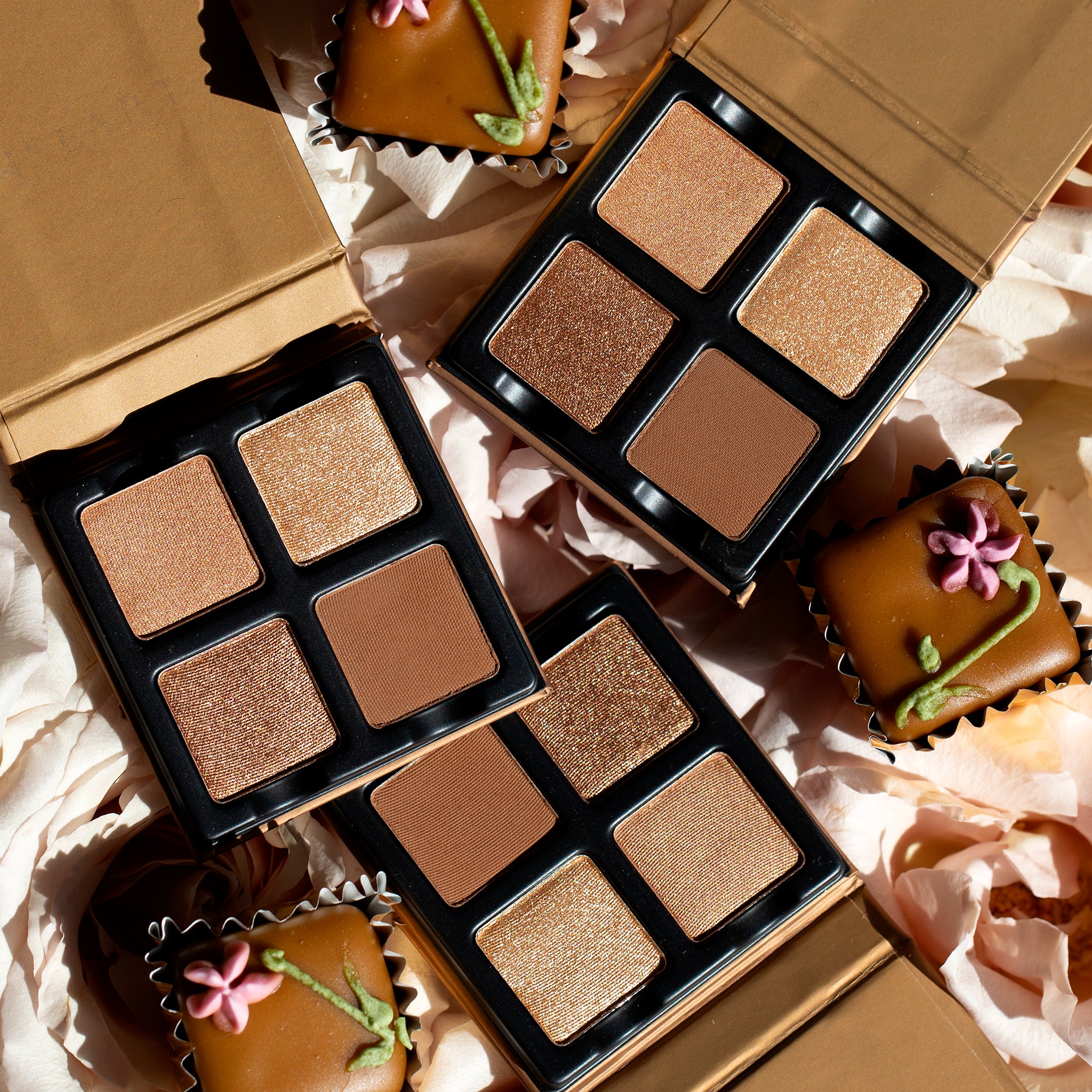 Petits Fours Praline featured with warm-toned Petits Fours palettes in a flat lay composition.