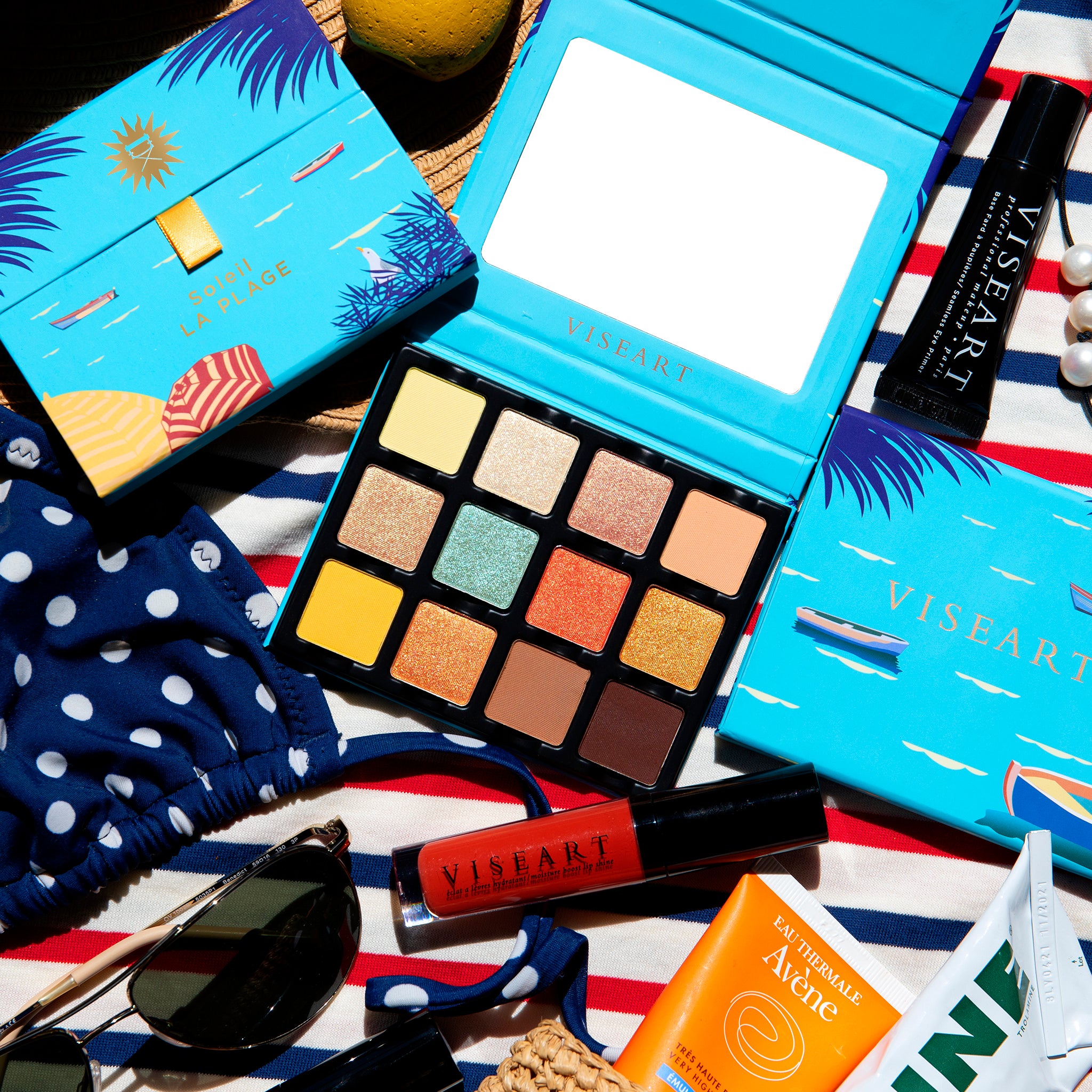 Open palette of vibrant beach tones including coral shimmer, sunbeam gold, and bronze foil for summer glam.