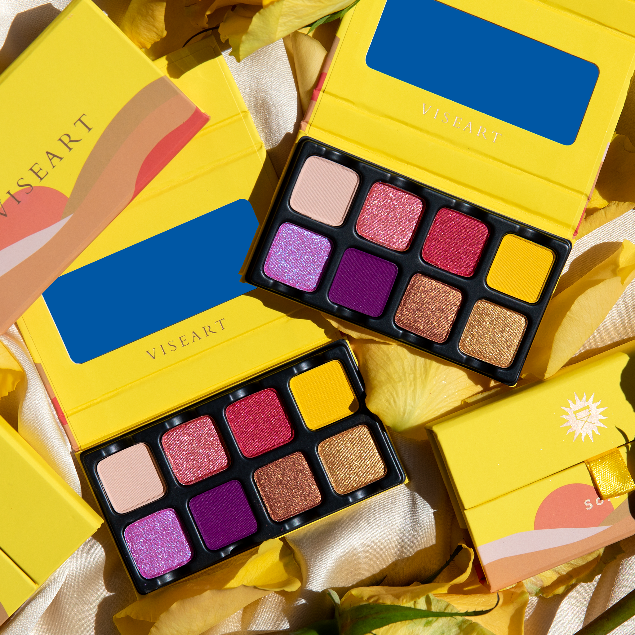 Open Petit Pro Soleil palette featuring bright citrus, coral, lavender, and golden shimmer tones.
