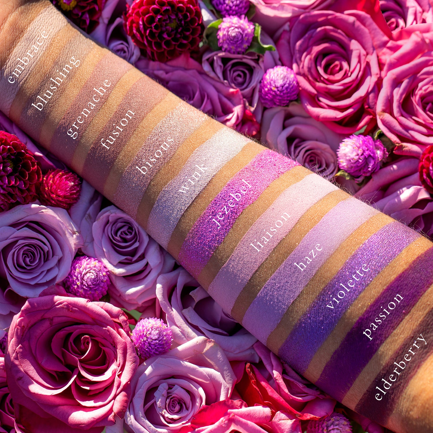 Swatches of Violette Étendu on deep skin with vibrant plum, rosewood, duochrome purple, and metallic taupe.