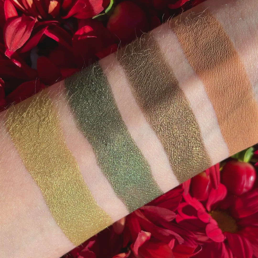 Video of Swatches of eyeshadow powders from the Petits Fours - Peridot palette on fair skin, showcasing elegant green and earthy brown tones to add a luxe look to any eye.