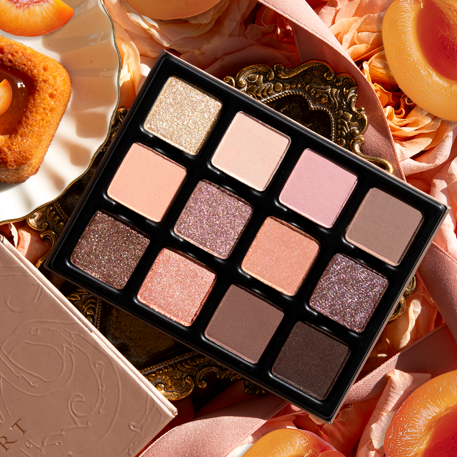 Close-up of Apricotine Lumière Étendu palette with spring-inspired shades in mattes, satins, and duochromes
