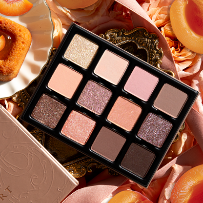Close-up of Apricotine Lumière Étendu palette with spring-inspired shades in mattes, satins, and duochromes
