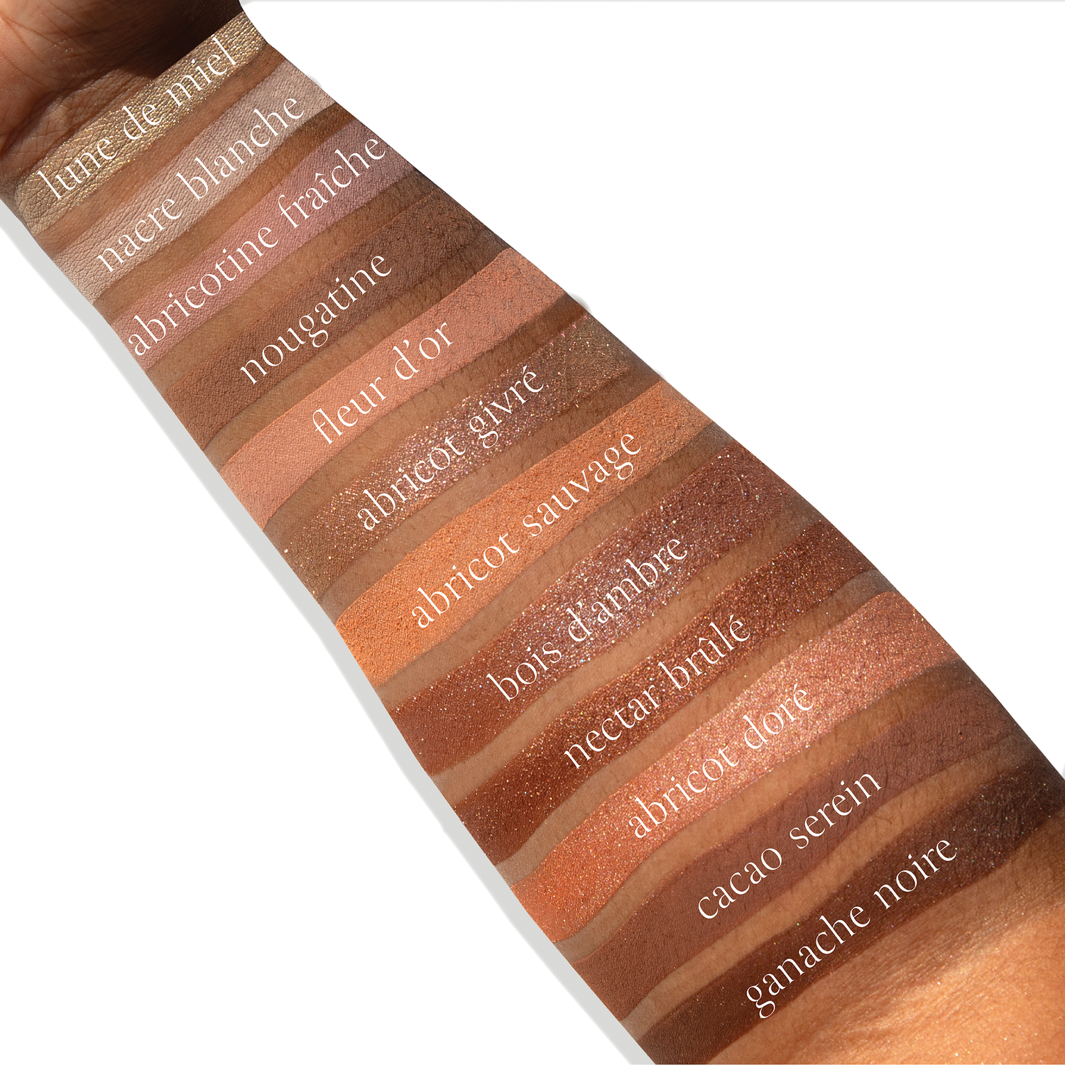 Swatches of Apricotine Lumière Étendu eyeshadow palette fair skin, deep skin, shimmer matte, duochrome