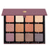 Open Petites Shimmers Paris Nudes 12-pan palette displaying 12 pressed powders in a range of nude, peach, rose and plum shades in satin, metallic, and shimmery hues.
