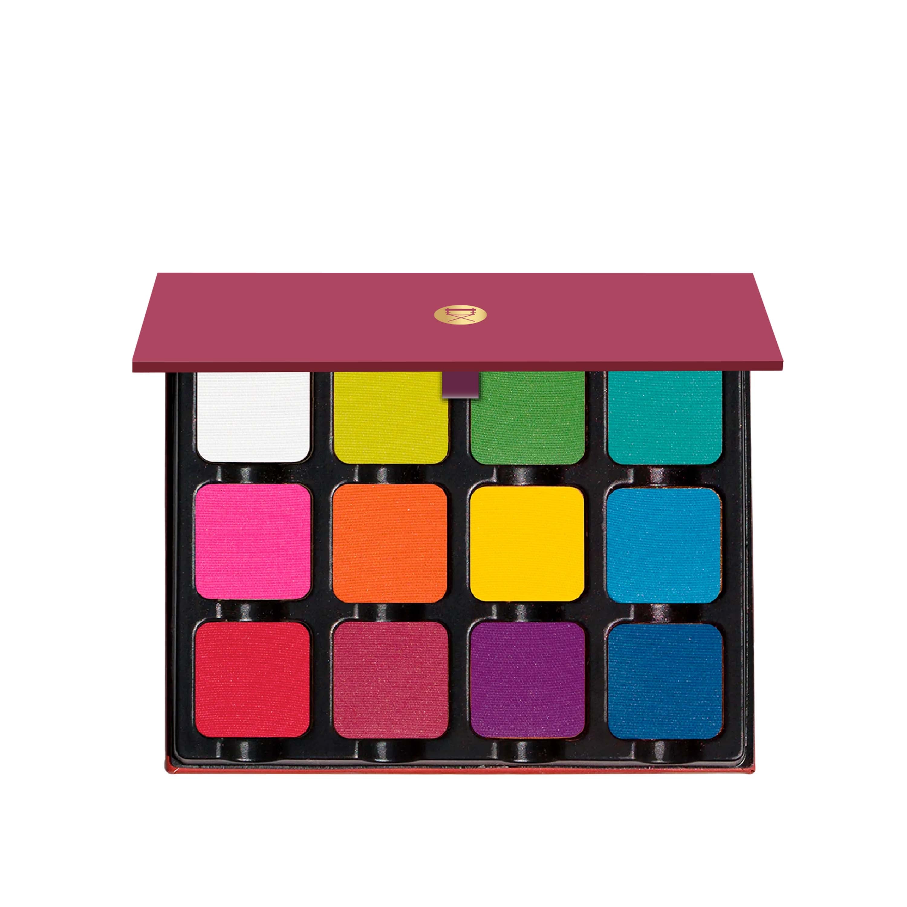 Open palette with 12 bright matte pigments including red, blue, yellow, and green, perfect for creative, editorial makeup.
