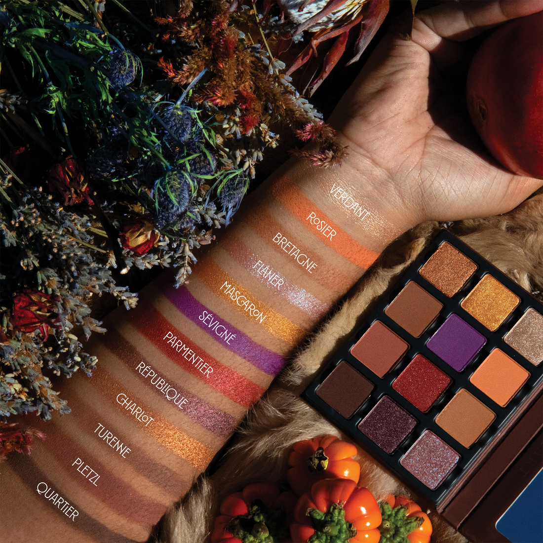 Swatches on deep skin displaying latte tones, warm brown shimmer, and espresso mattes with smooth blendability.