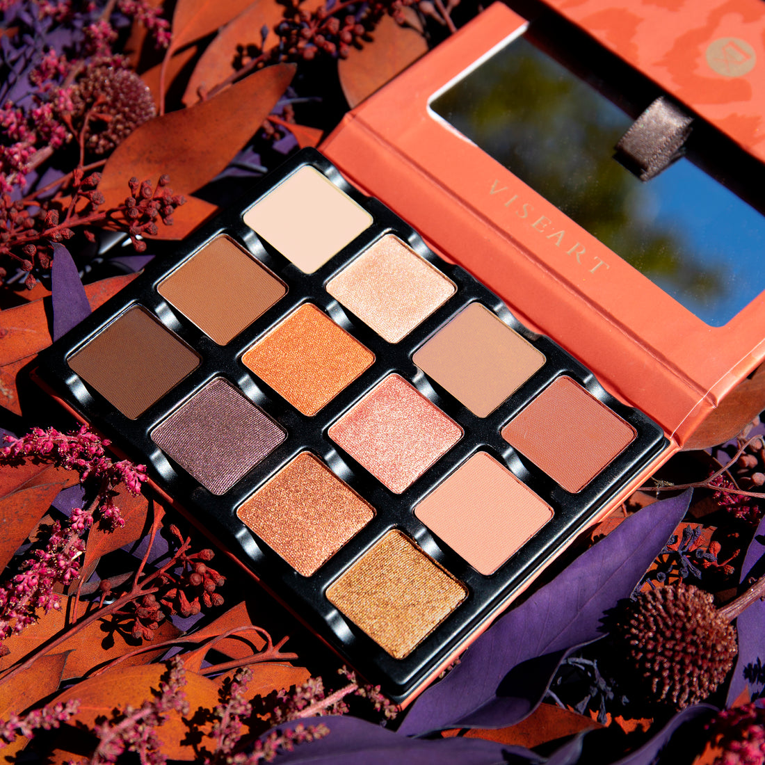 Open palette of rich warm neutrals including espresso, bronze, and terracotta with matte, satin, and shimmer finishes.